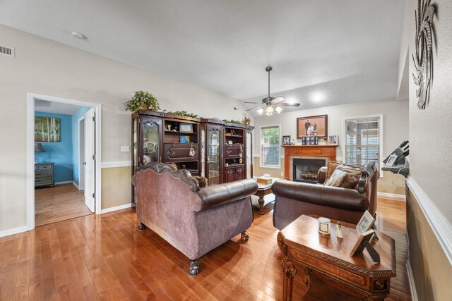 845 Nandina Ct, Clarksville, TN 37043 - living area featuring a ceiling fan, wood finished floors, a fireplace, and baseboards