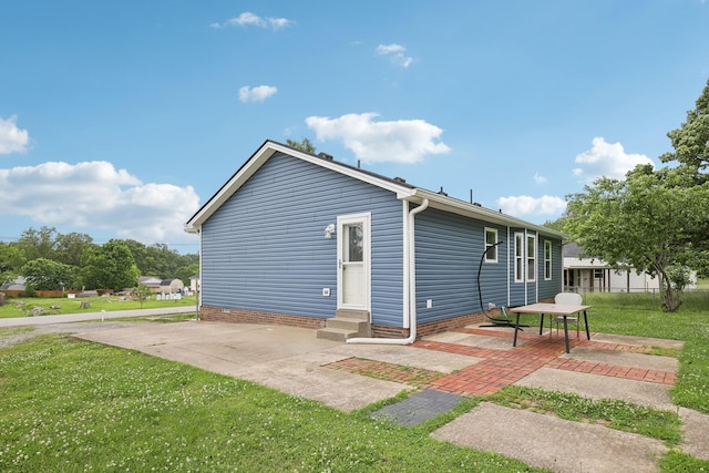976 Long Beech Dr, Clarksville, TN 37042 - view of side of property with entry steps, a lawn, and a patio
