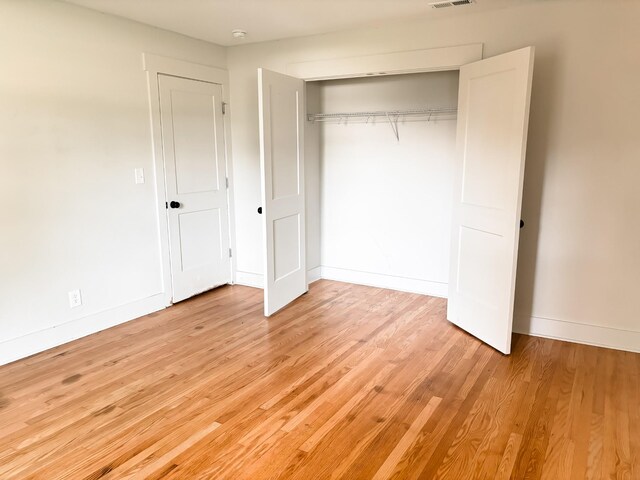 400 Circle Dr, Estill Springs, TN 37330 - unfurnished bedroom with light wood finished floors, a closet, and baseboards