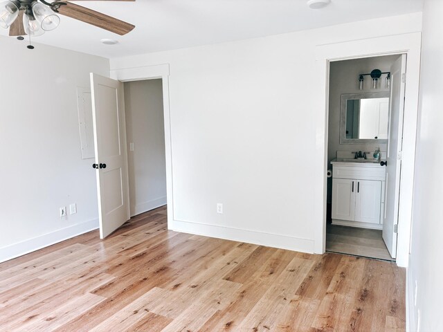 400 Circle Dr, Estill Springs, TN 37330 - unfurnished bedroom featuring light wood-style floors, connected bathroom, baseboards, and a ceiling fan