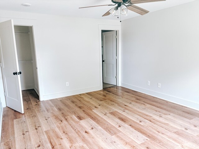 400 Circle Dr, Estill Springs, TN 37330 - unfurnished bedroom featuring light wood-style flooring, a spacious closet, a closet, and baseboards