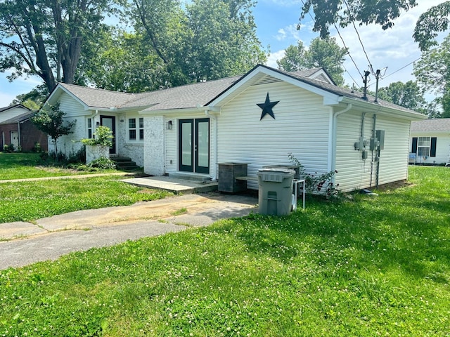 400 Circle Dr, Estill Springs, TN 37330 - back of property with a yard, roof with shingles, and french doors