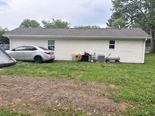 400 Circle Dr, Estill Springs, TN 37330 - view of side of property featuring central air condition unit, a lawn, and roof with shingles
