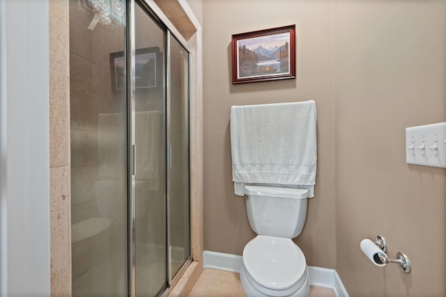 1130 Crater Hill Dr, Nashville, TN 37215 - bathroom featuring toilet, a shower stall, and baseboards