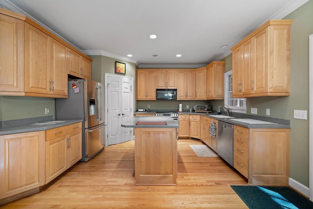 1130 Crater Hill Dr, Nashville, TN 37215 - kitchen with appliances with stainless steel finishes, ornamental molding, a kitchen island, light wood-style flooring, and recessed lighting
