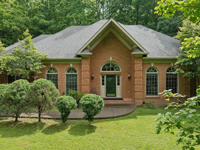 1130 Crater Hill Dr, Nashville, TN 37215 - view of front of home featuring a shingled roof, a front yard, and brick siding