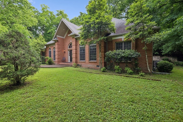 1130 Crater Hill Dr, Nashville, TN 37215 - view of front of house with brick siding, a front lawn, and a shingled roof