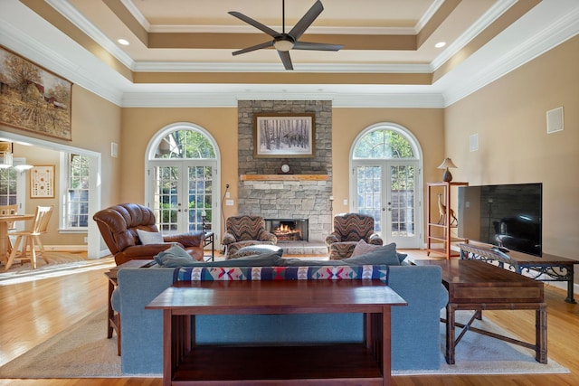 1130 Crater Hill Dr, Nashville, TN 37215 - living room featuring french doors, wood finished floors, a stone fireplace, ornamental molding, and a high ceiling