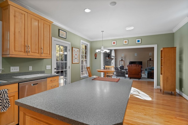 1130 Crater Hill Dr, Nashville, TN 37215 - kitchen with light wood finished floors, a chandelier, crown molding, dark countertops, and a center island