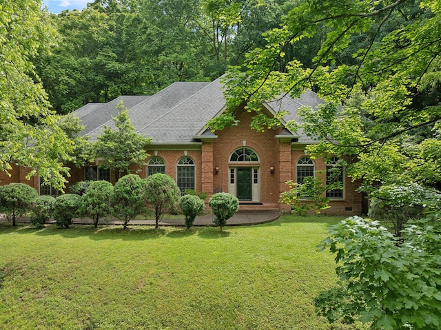 1130 Crater Hill Dr, Nashville, TN 37215 - view of front of home featuring a shingled roof, brick siding, a front yard, and crawl space
