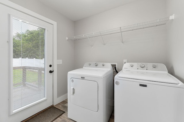 7959 Monterey Hwy, Sparta, TN 38583 - laundry room with washer and dryer, light wood-style flooring, and baseboards