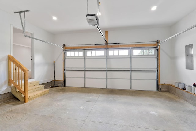 7959 Monterey Hwy, Sparta, TN 38583 - garage with electric panel, a garage door opener, and recessed lighting