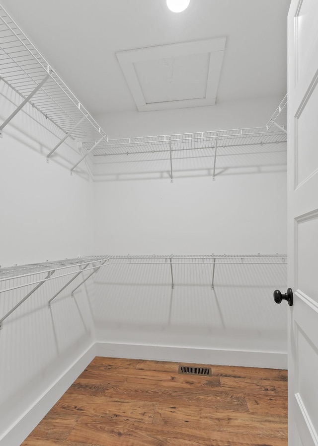 7959 Monterey Hwy, Sparta, TN 38583 - spacious closet featuring attic access and wood finished floors