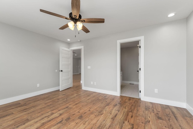 7959 Monterey Hwy, Sparta, TN 38583 - unfurnished bedroom with baseboards, wood finished floors, recessed lighting, and ceiling fan