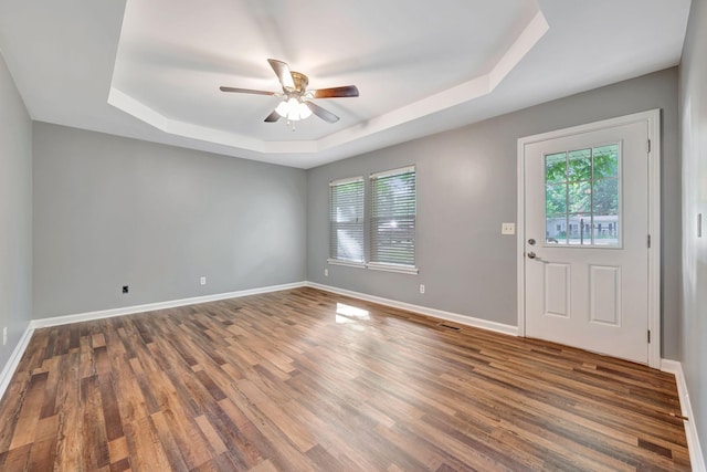 2290 Petway Rd, Ashland City, TN 37015 - spare room with a raised ceiling, ceiling fan, wood finished floors, and baseboards