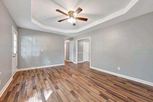 2290 Petway Rd, Ashland City, TN 37015 - spare room with a raised ceiling, a ceiling fan, baseboards, and wood finished floors