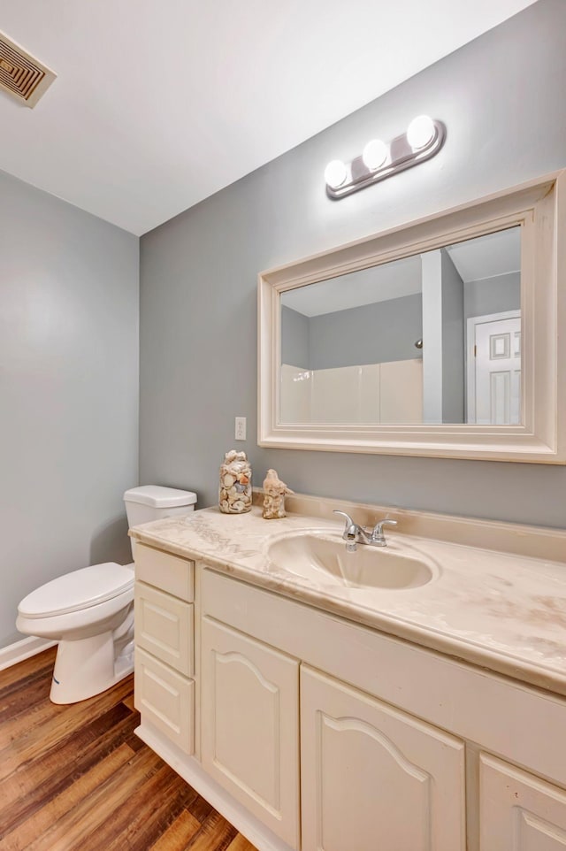 2290 Petway Rd, Ashland City, TN 37015 - bathroom featuring wood finished floors, toilet, and vanity