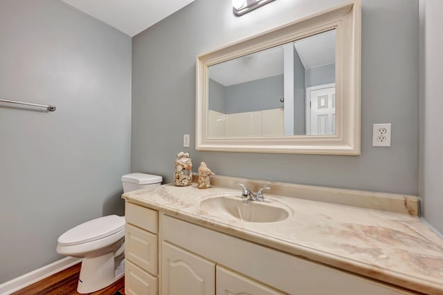 2290 Petway Rd, Ashland City, TN 37015 - bathroom with vanity, toilet, and wood finished floors