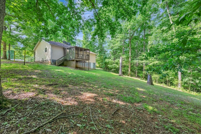 2290 Petway Rd, Ashland City, TN 37015 - view of green lawn featuring a sunroom and stairway