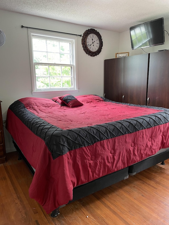 438 Tampa Dr, Nashville, TN 37211 - bedroom featuring wood finished floors and a textured ceiling