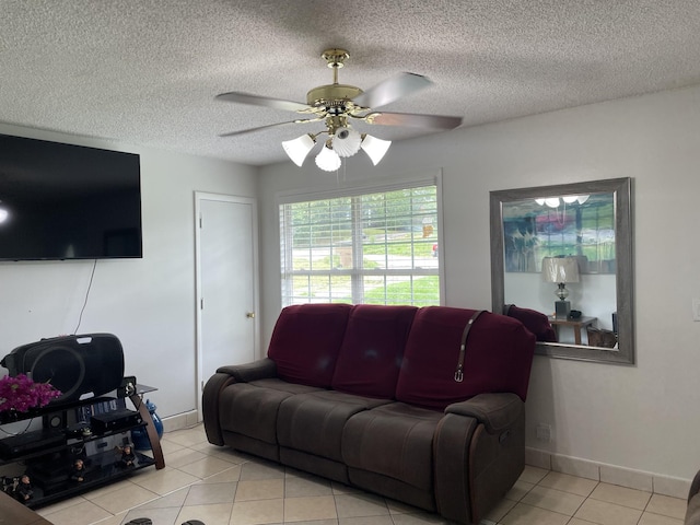 438 Tampa Dr, Nashville, TN 37211 - living area with light tile patterned floors, ceiling fan, a textured ceiling, and baseboards