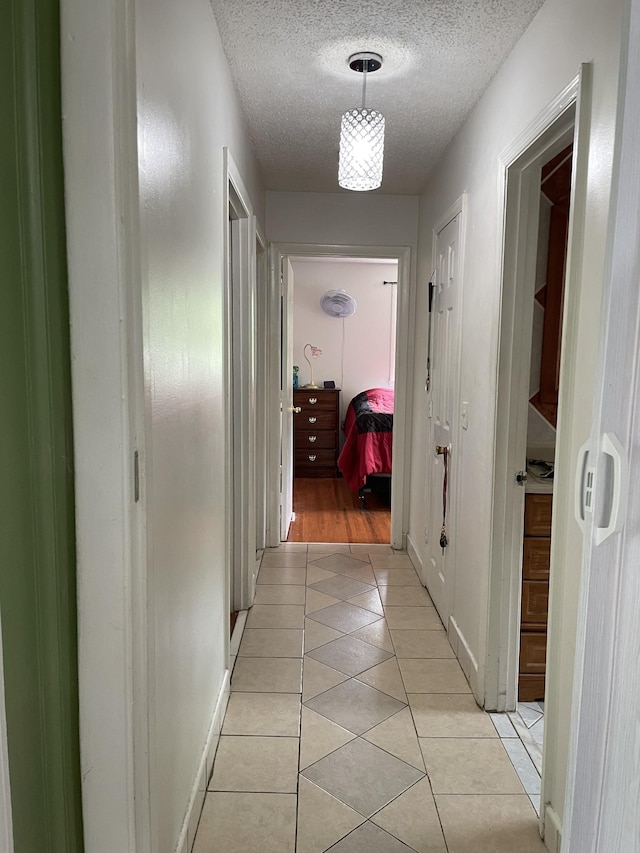 438 Tampa Dr, Nashville, TN 37211 - corridor with a textured ceiling and light tile patterned flooring