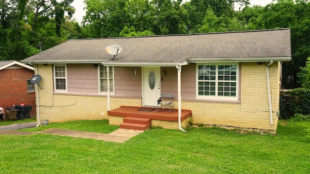 438 Tampa Dr, Nashville, TN 37211 - view of front facade featuring a front lawn, brick siding, and a shingled roof