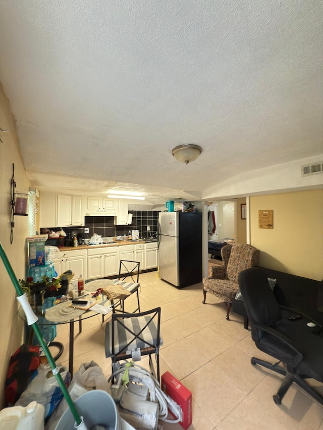 438 Tampa Dr, Nashville, TN 37211 - dining space with a textured ceiling and light tile patterned flooring