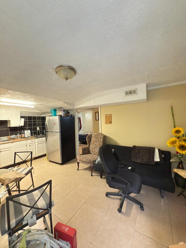 438 Tampa Dr, Nashville, TN 37211 - living room with a textured ceiling and light tile patterned floors