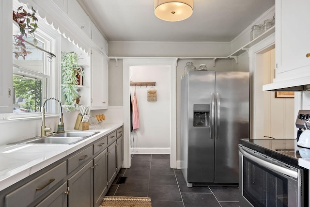 36 Hillcrest Dr, Sparta, TN 38583 - kitchen with stainless steel appliances, a sink, gray cabinets, dark tile patterned floors, and under cabinet range hood