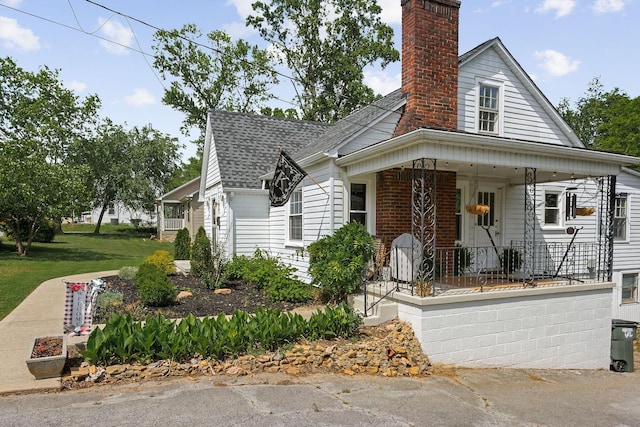 36 Hillcrest Dr, Sparta, TN 38583 - bungalow-style house with covered porch, a chimney, and roof with shingles