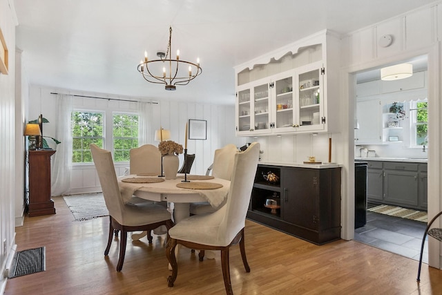 36 Hillcrest Dr, Sparta, TN 38583 - dining space with plenty of natural light, wood finished floors, and a chandelier
