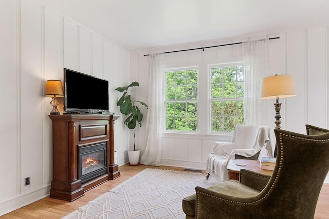 36 Hillcrest Dr, Sparta, TN 38583 - living area with a decorative wall, wood finished floors, and a glass covered fireplace