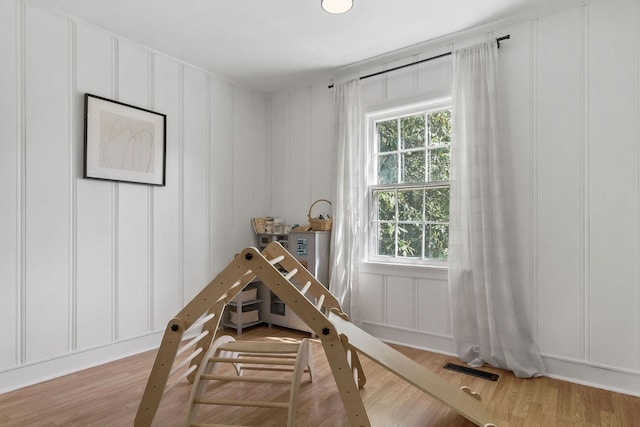 36 Hillcrest Dr, Sparta, TN 38583 - rec room featuring a decorative wall, plenty of natural light, and wood finished floors