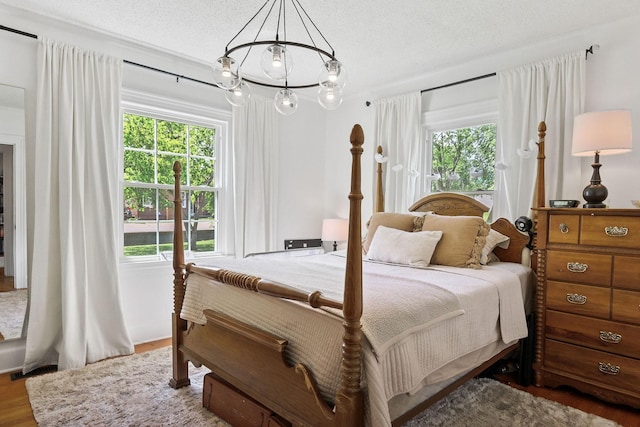 36 Hillcrest Dr, Sparta, TN 38583 - bedroom featuring multiple windows, wood finished floors, and a textured ceiling