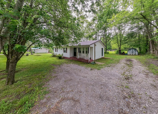 1689 Pleasant Ridge Rd, Huntland, TN 37345 - single story home with a front yard, metal roof, and a porch