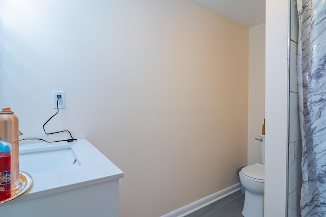 1689 Pleasant Ridge Rd, Huntland, TN 37345 - bathroom with toilet, vanity, baseboards, and a shower with shower curtain