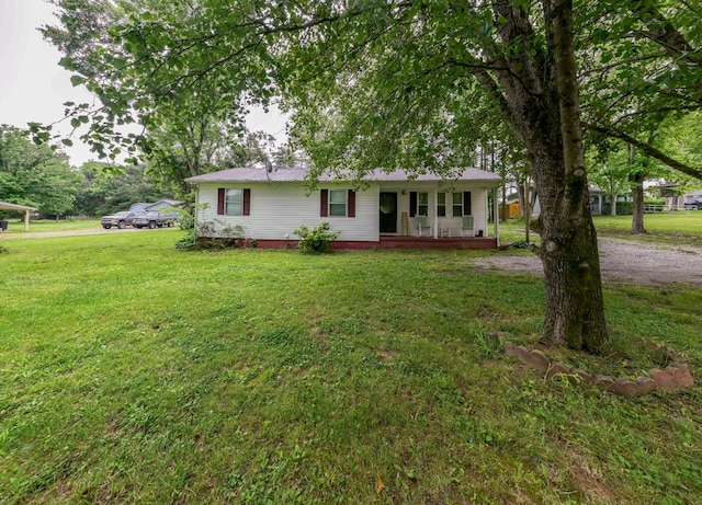1689 Pleasant Ridge Rd, Huntland, TN 37345 - ranch-style house with a porch and a front yard