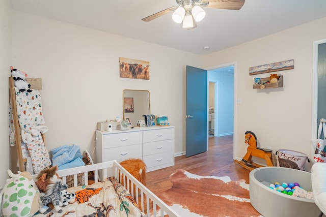 1689 Pleasant Ridge Rd, Huntland, TN 37345 - bedroom with light wood finished floors, a ceiling fan, and baseboards