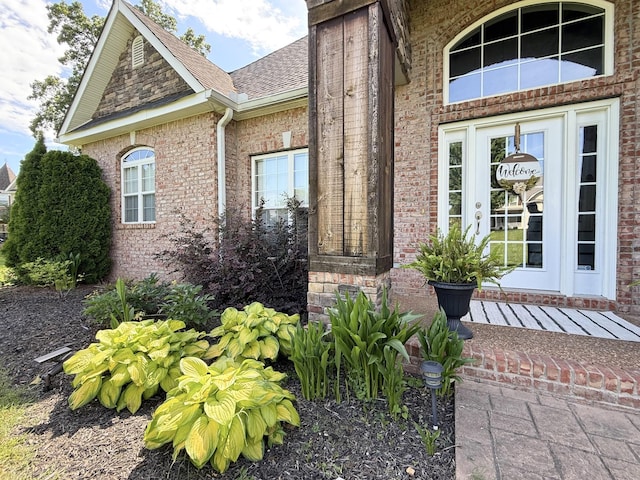 1002 Bradby Dr, Burns, TN 37029 - property entrance featuring brick siding and a shingled roof