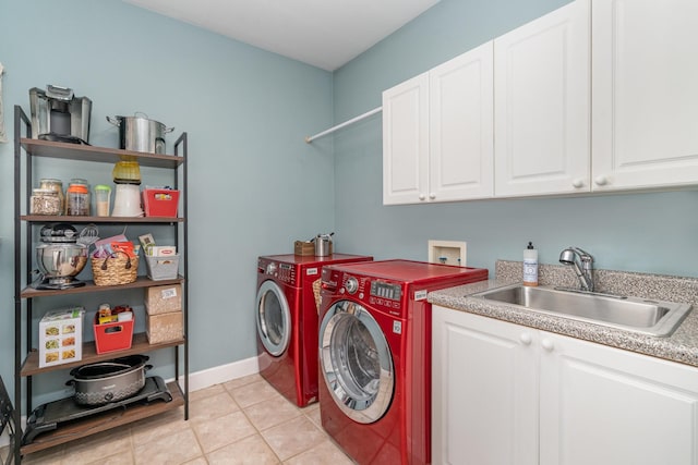 1002 Bradby Dr, Burns, TN 37029 - washroom with separate washer and dryer, cabinet space, light tile patterned flooring, and baseboards