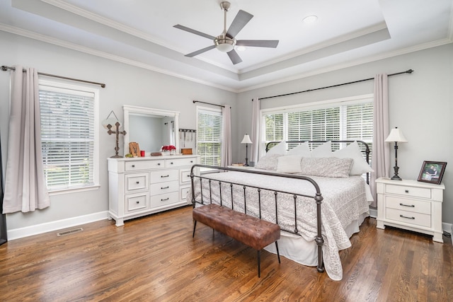 1002 Bradby Dr, Burns, TN 37029 - bedroom with wood finished floors, ornamental molding, a raised ceiling, baseboards, and a ceiling fan