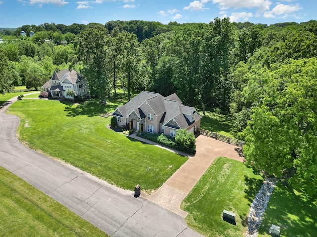 1002 Bradby Dr, Burns, TN 37029 - aerial view of property and surrounding area with a heavily wooded area