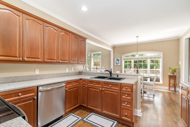 1002 Bradby Dr, Burns, TN 37029 - kitchen with dishwasher, a sink, wood finished floors, healthy amount of natural light, and crown molding