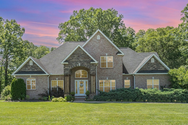 1002 Bradby Dr, Burns, TN 37029 - traditional home featuring french doors, a yard, brick siding, and roof with shingles