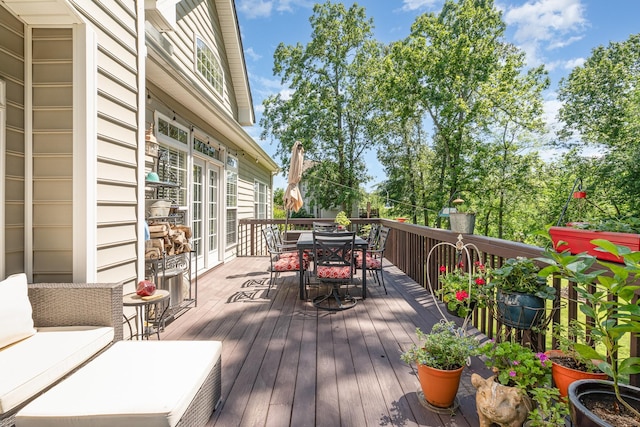 1002 Bradby Dr, Burns, TN 37029 - wooden deck with outdoor dining space