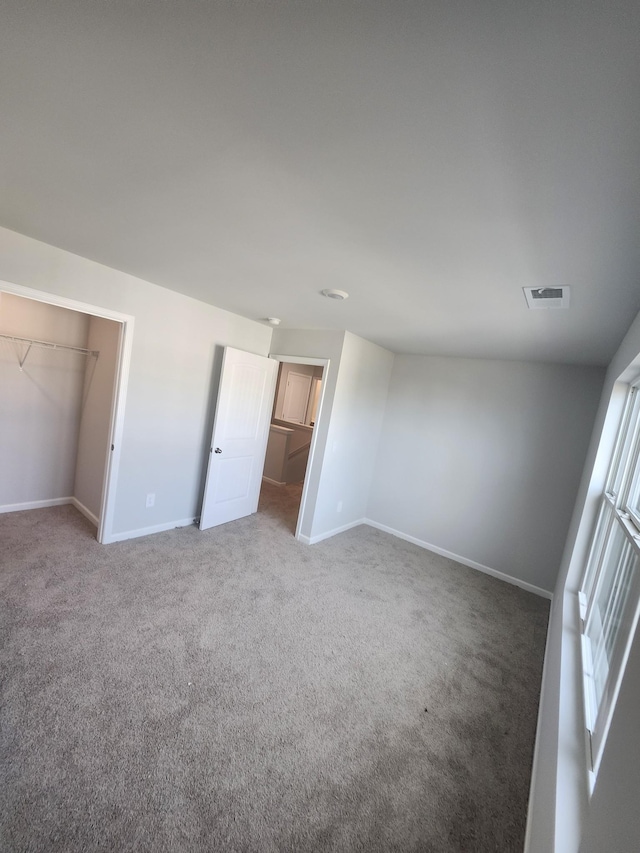 4417 Maxwell Rd, Antioch, TN 37013 - unfurnished bedroom featuring a spacious closet, carpet floors, baseboards, and a closet