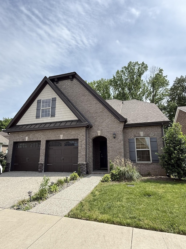 107 Auxley Ct, White House, TN 37188 - view of front of home with driveway, brick siding, a garage, and a front lawn
