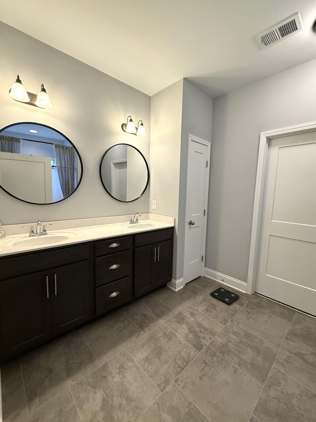 107 Auxley Ct, White House, TN 37188 - bathroom featuring double vanity and baseboards