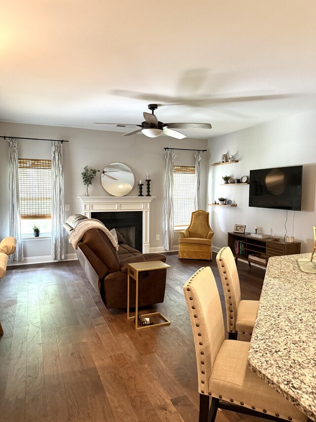 107 Auxley Ct, White House, TN 37188 - living area with ceiling fan, dark wood-type flooring, and a fireplace